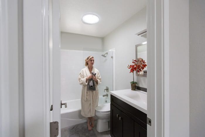 Woman in Daylit Bathroom